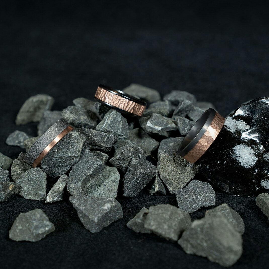 three gold-colored rings